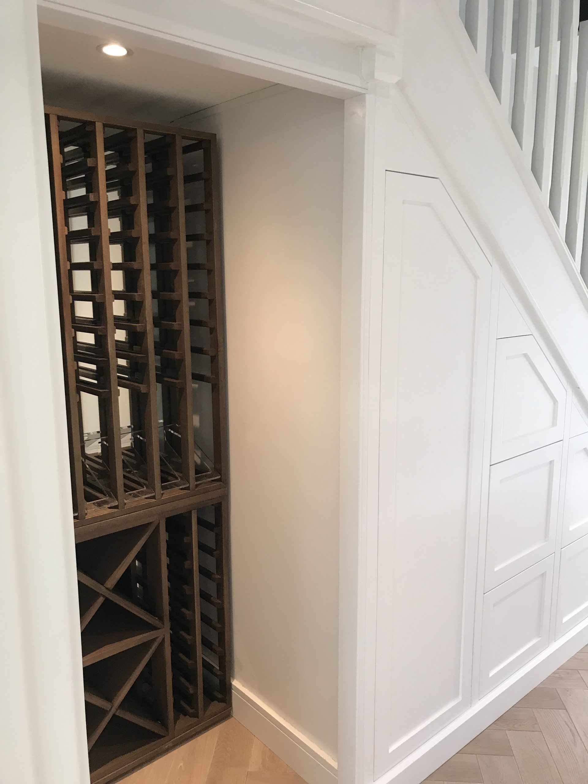 Six drawer and coat unit with space for a large wine rack